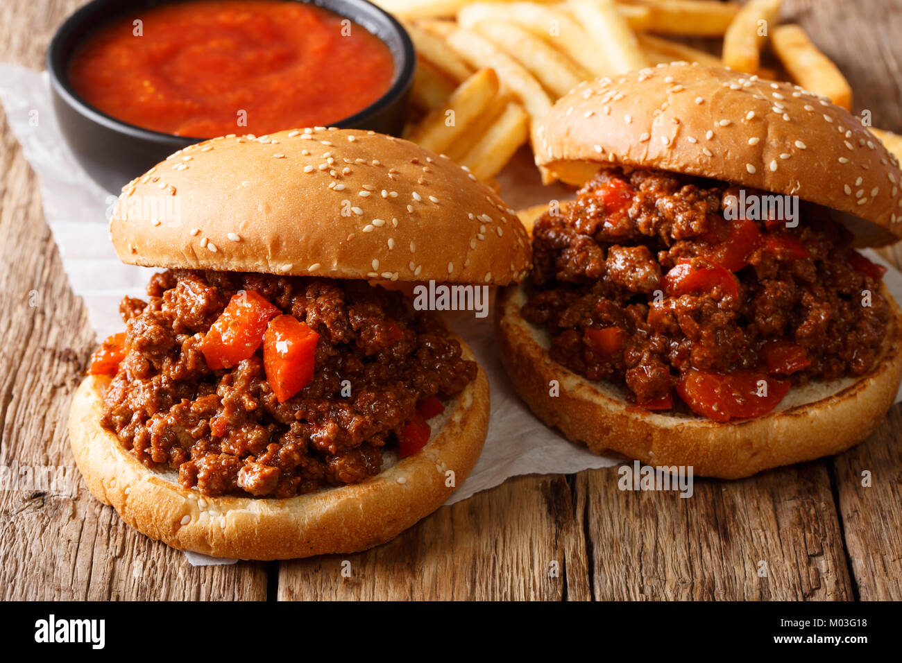 Hot American Delicious sandwiches Sloppy Joe with beef and french fries, ketchup closeup on the table. horizontal Stock Photo