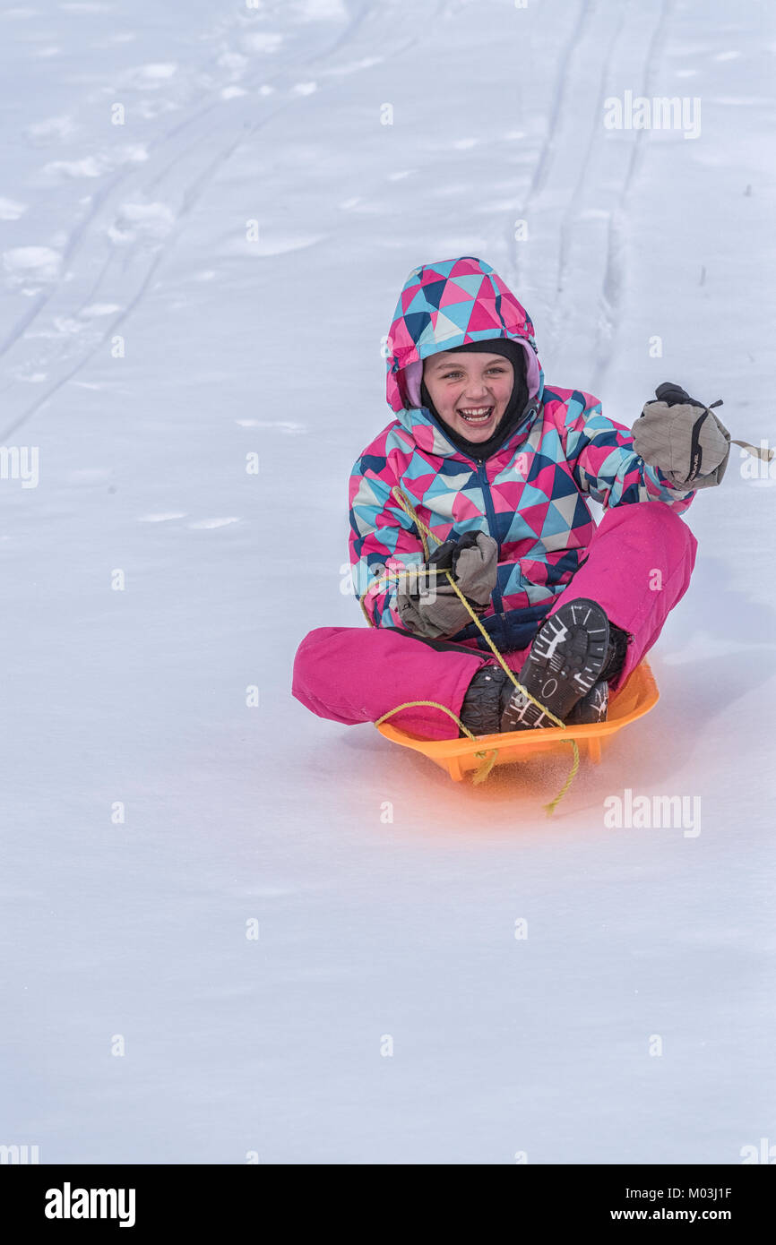 Young girl sliding down slide hi-res stock photography and images - Alamy