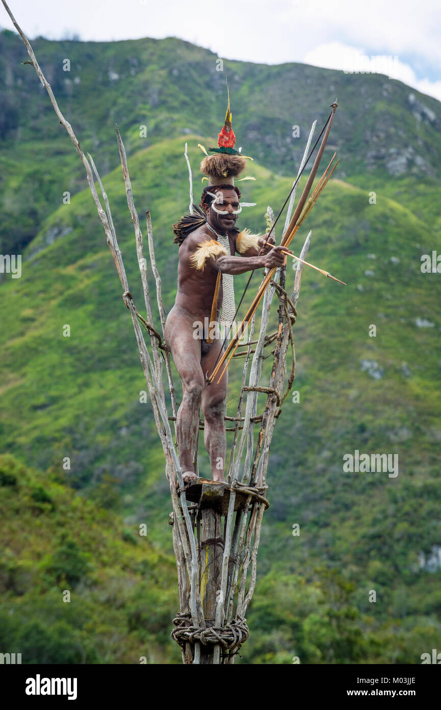Warrior of Dani tribe on the observation tower. July 2016 Stock Photo