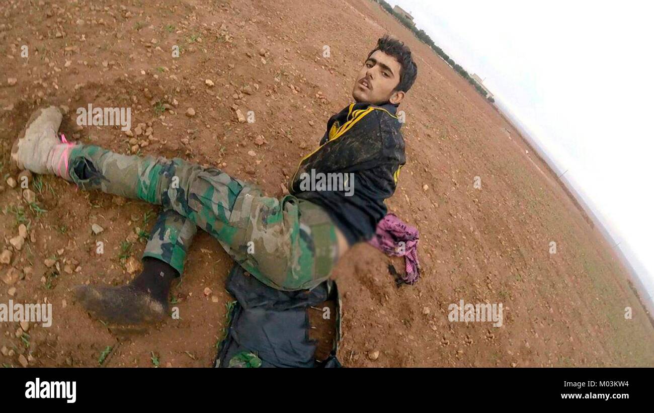 Still image taken from a propaganda video released January 15, 2018 showing Syrian Army soldiers injured and begging for their lives during fighting with Islamic State fighters near Abu Duhur Airbase in the Idlib Governorate, Syria. Stock Photo