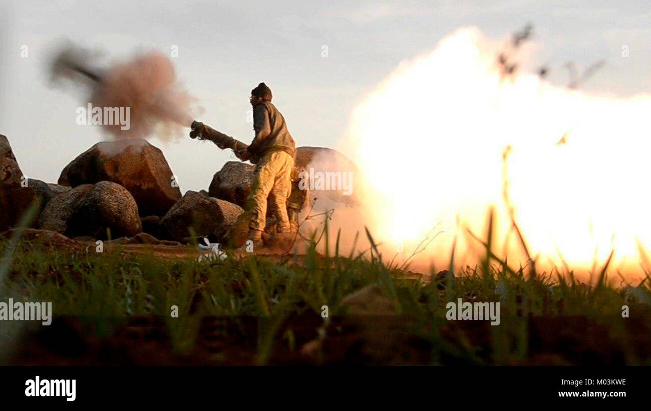 Still image taken from a propaganda video released January 13, 2018 showing Al Qaeda affiliated Turkestan Islamic Party fighters firing rockets at Syrian Army positions near Abu Duhur Airbase in the Idlib Governorate, Syria. Stock Photo