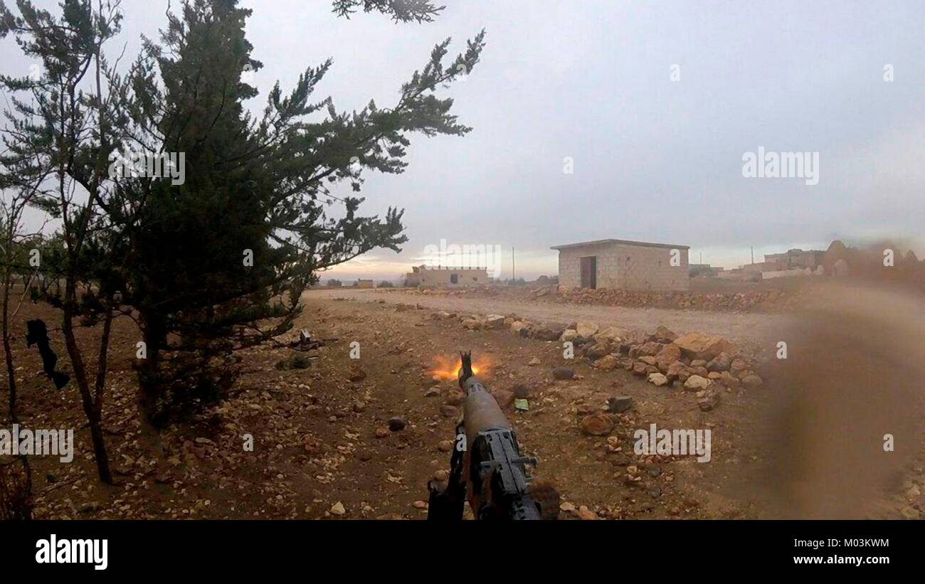 Still image taken from a propaganda video released January 15, 2018 showing Islamic State fighters firing on Syrian Army soldiers near Abu Duhur Airbase in the Idlib Governorate, Syria. Stock Photo