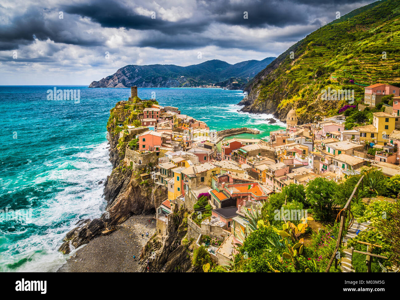 Beautiful view of Vernazza, one of the five famous fisherman villages of Cinque Terre with dramatic cloudscape at sunset in Liguria, Italy Stock Photo