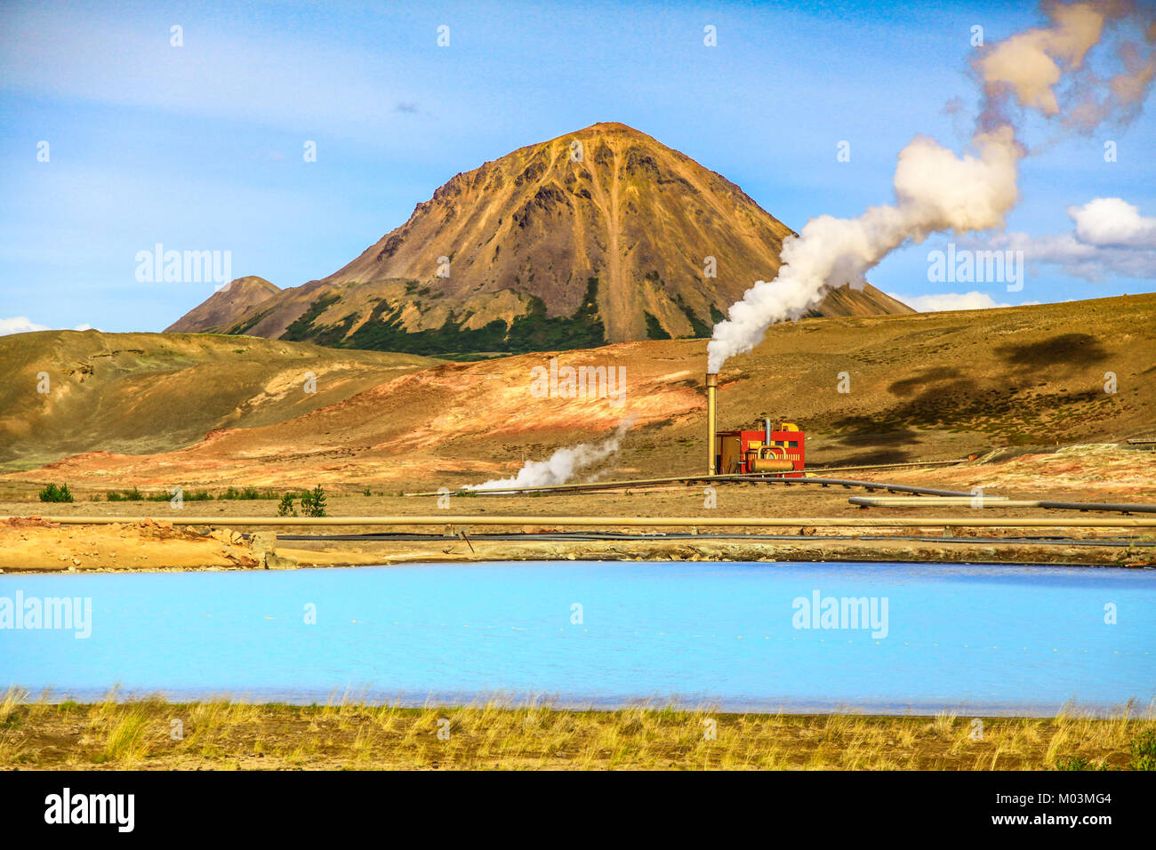 Geothermal landscape at Krafla Bjarnarflag Diatomite power station with Lake Myvatn and Hlidarfjall Mountain in the background, Myvatn area, northern  Stock Photo