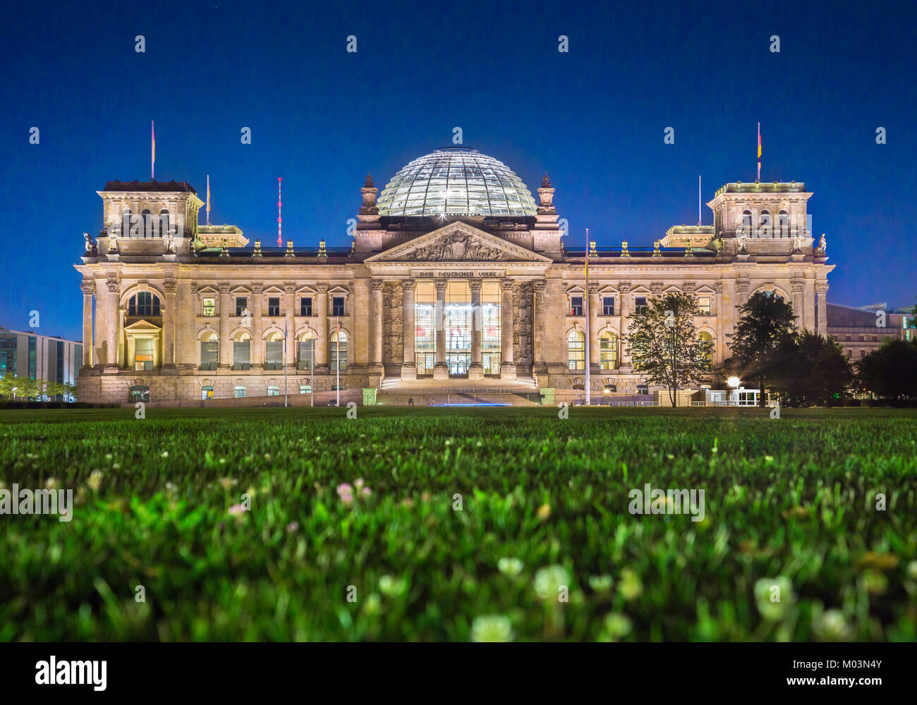 Panoramic view of famous Reichstag building, seat of the German Parliament (Deutscher Bundestag), in twilight during blue hour at dusk, Berlin, German Stock Photo