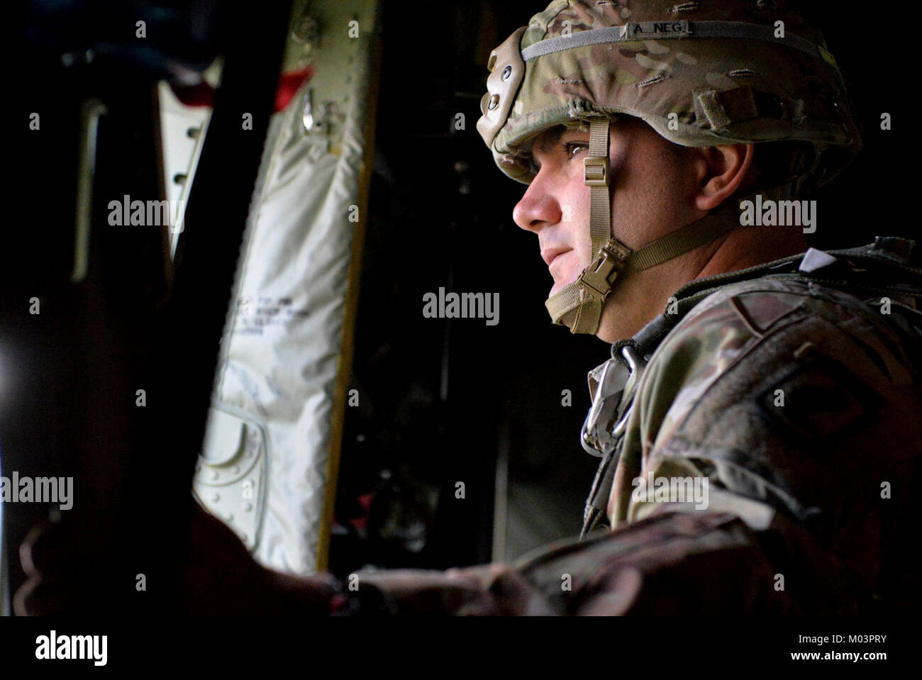 A U.S. Army jump master surveys the drop zone prior to paratroopers