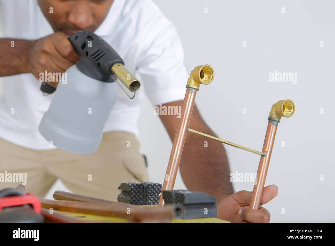 industrial worker using propane gas torch for soldering copper pipes Stock Photo Alamy