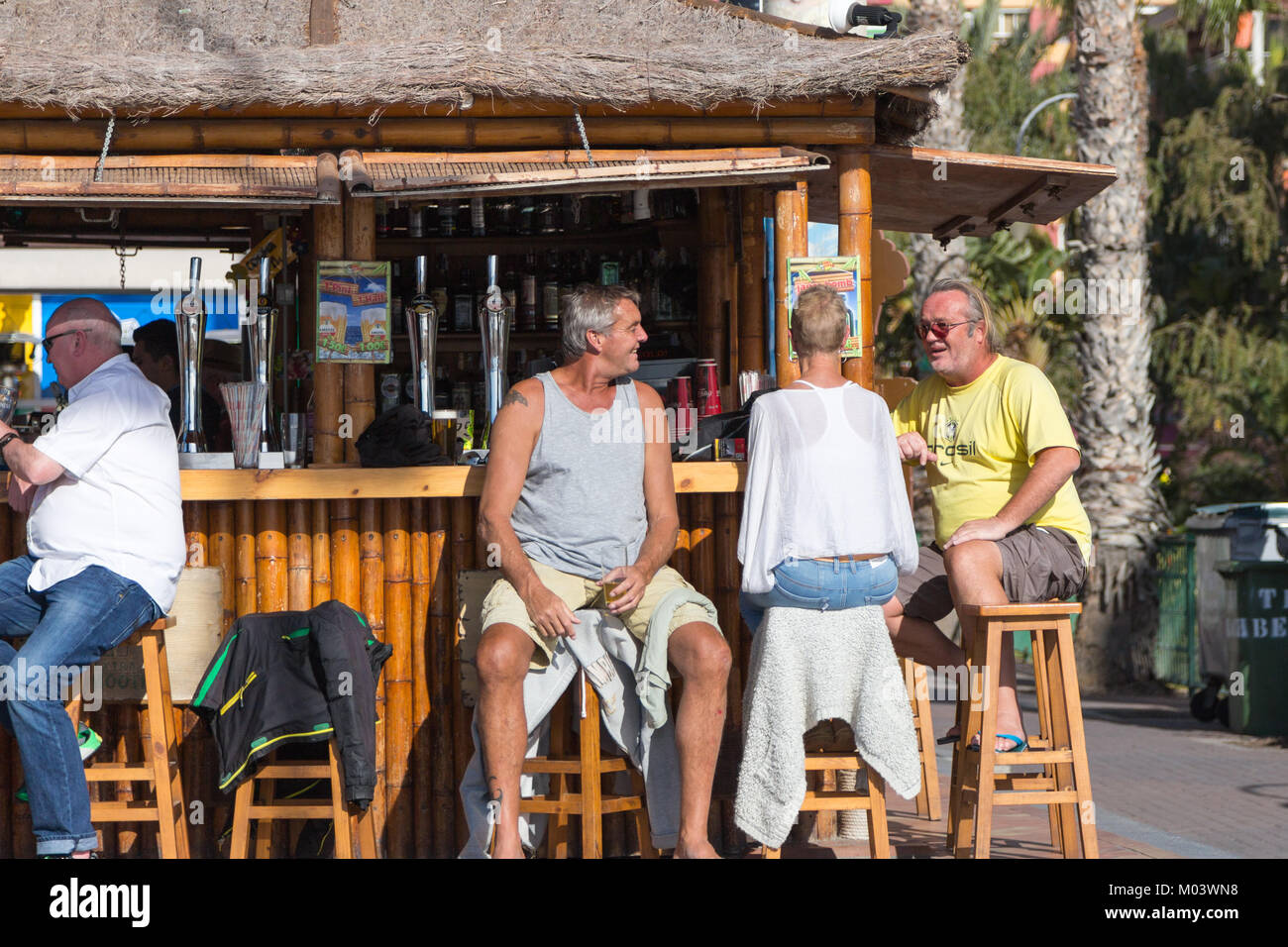 Tiki Beach Bar, Levante Beach, Benidorm, Costa Blanca, Spain, 18 January 2018. British holidaymakers escape the cold weather in the UK. Tourists and locals enjoy the winter sun and daytime temperatures in the high 20's Celsius at the beachfront Tiki Bar. Credit: Mick Flynn/Alamy Live News Stock Photo