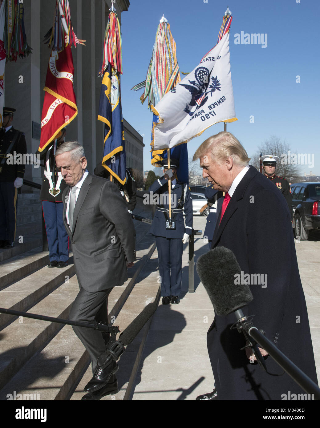 Washington, District of Columbia, USA. 18th Jan, 2018. United States President Donald J. Trump, accompanied by US Secretary of Defense Jim Mattis, left, walks up the steps into the Pentagon after making a statement in Washington, DC on Thursday, January 18, 2018.Credit: Ron Sachs/Pool via CNP Credit: Ron Sachs/CNP/ZUMA Wire/Alamy Live News Stock Photo
