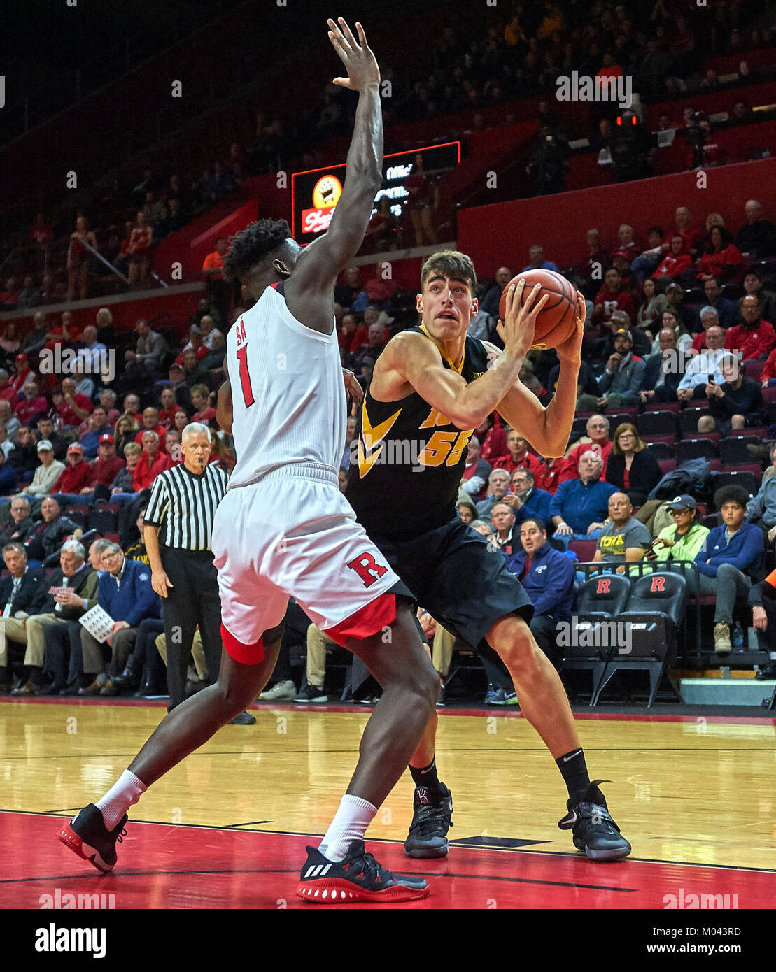 Piscataway, New Jersey, USA. 18th Jan, 2018. Iowa Hawkeyes forward Luka Garza (55) is defended by Rutgers Scarlet Knights forward Candido Sa (1) during the first half between the Iowa Hawkeyes and the Rutgers Scarlet Knights at Rutgers Athletic Center in Piscataway, New Jersey. Rutgers defeated Iowa 80-64. Duncan Williams/CSM/Alamy Live News Stock Photo