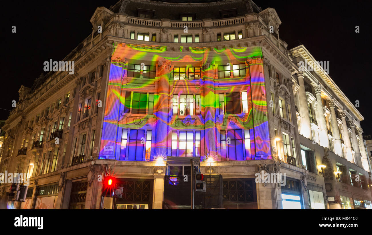 London, UK. 18th Jan 2018. Lumiere London 2018 Lights festival.  Oxford Circus and parts of Regent Street are closed to traffic as people view the colourful images projected  onto buildings on Oxford Circus. Lumiere London is a light festival that presents an array of public art work and light installations across the capital. Credit: Imageplotter News and Sports/Alamy Live News Stock Photo