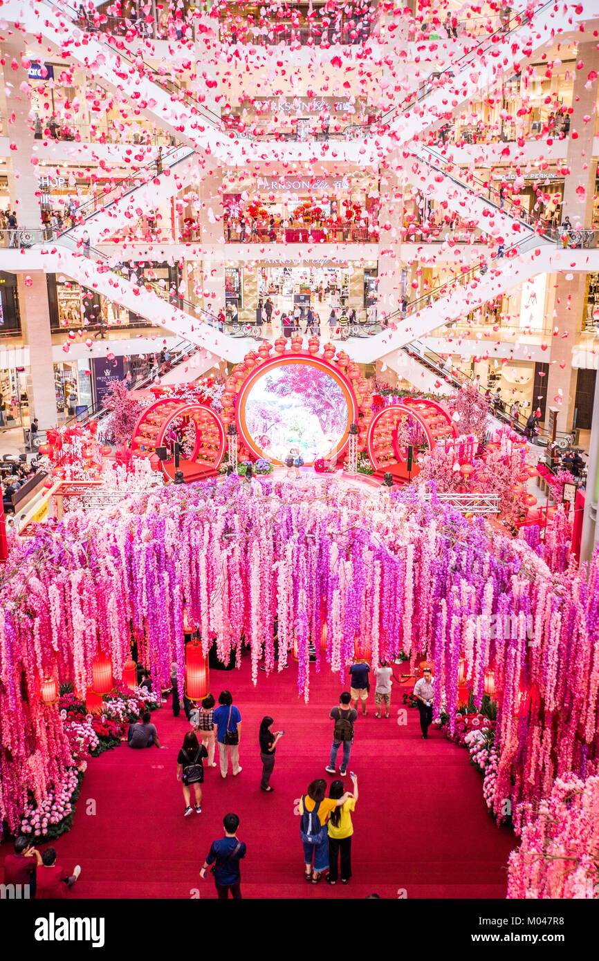 Kuala Lumpur, Malaysia. 19th Jan, 2018. People visit the decoration named "Dream Garden of Prosperity" which is set to welcome the upcoming Chinese lunar New Year at Pavilion shopping mall in Kuala Lumpur, Malaysia, Jan. 19, 2018. Credit: Zhu Wei/Xinhua/Alamy Live News Stock Photo