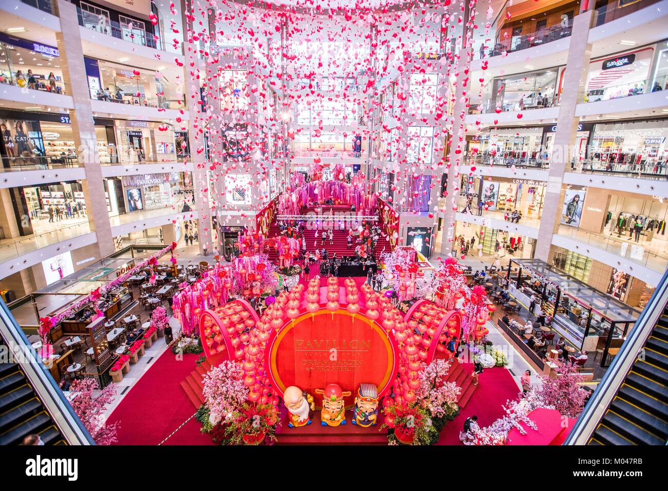 Kuala Lumpur, Malaysia. 19th Jan, 2018. People visit the decoration named "Dream Garden of Prosperity" which is set to welcome the upcoming Chinese lunar New Year at Pavilion shopping mall in Kuala Lumpur, Malaysia, Jan. 19, 2018. Credit: Zhu Wei/Xinhua/Alamy Live News Stock Photo