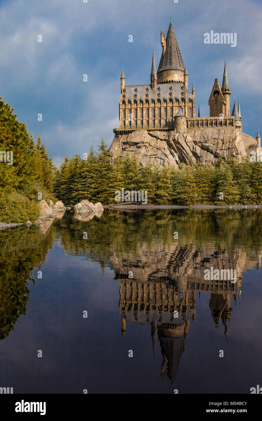 Replica Hogwarts school of wizardry reflected on the lake. Stock Photo