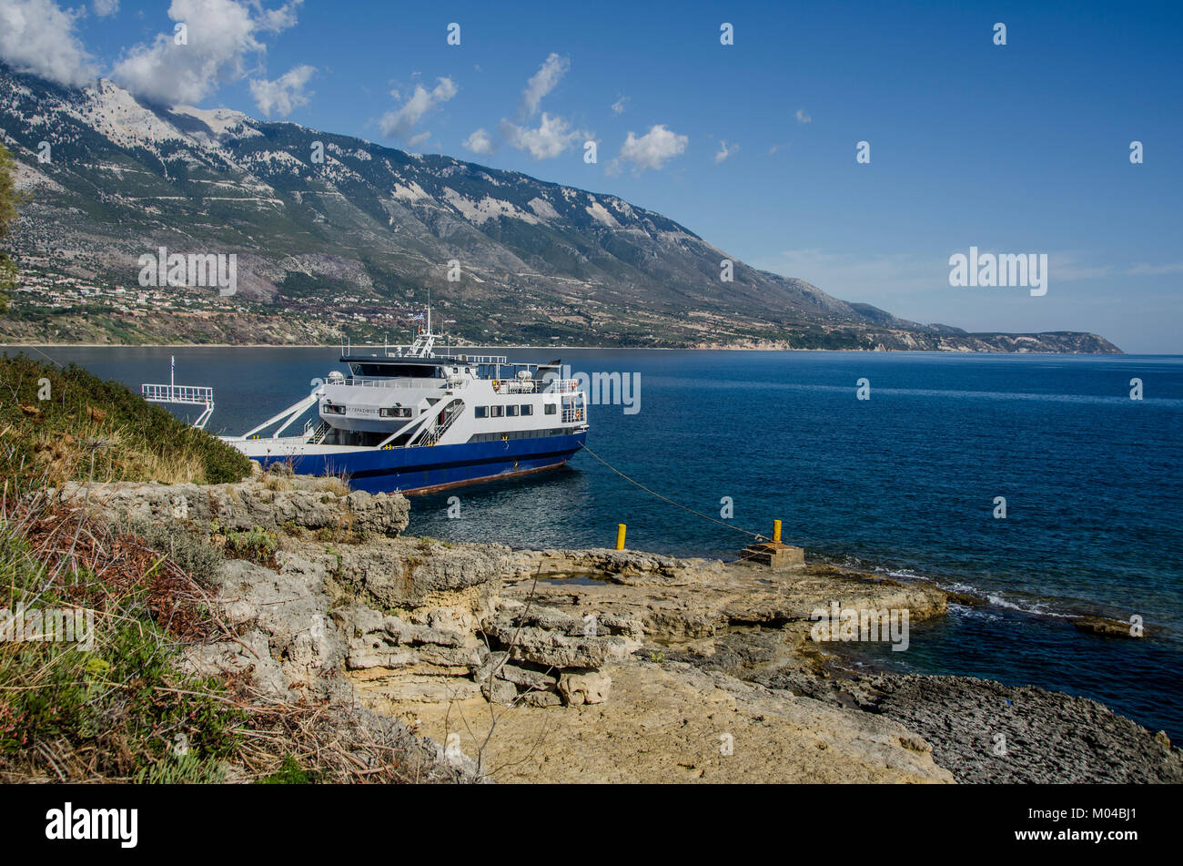 Panoramic view of the Kefalonia coasts and ferry moored in the small port of Pessada Stock Photo