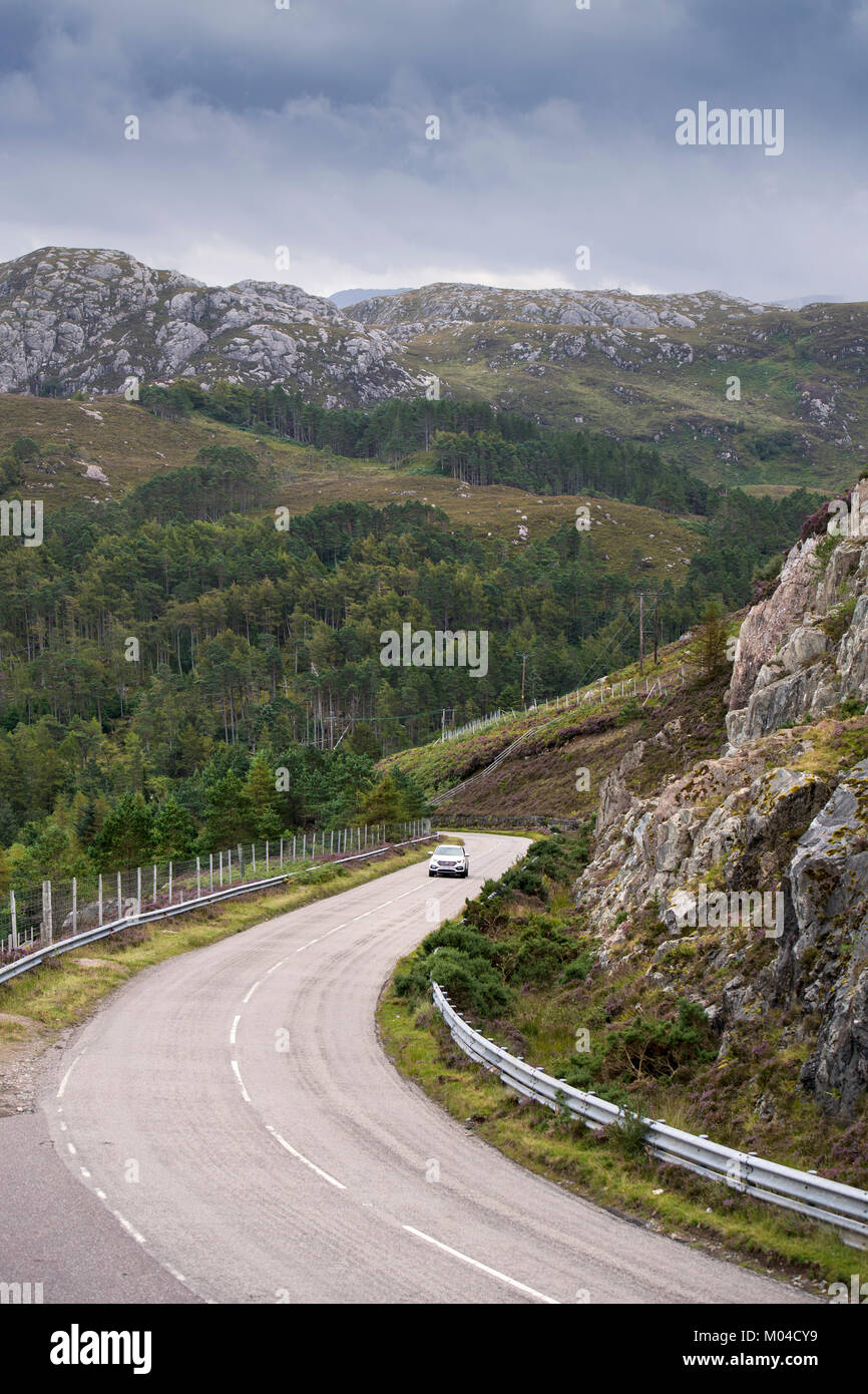 Car driving along the North Coast 500 scenic route near Laide in Wester Ross, Scotland Stock Photo
