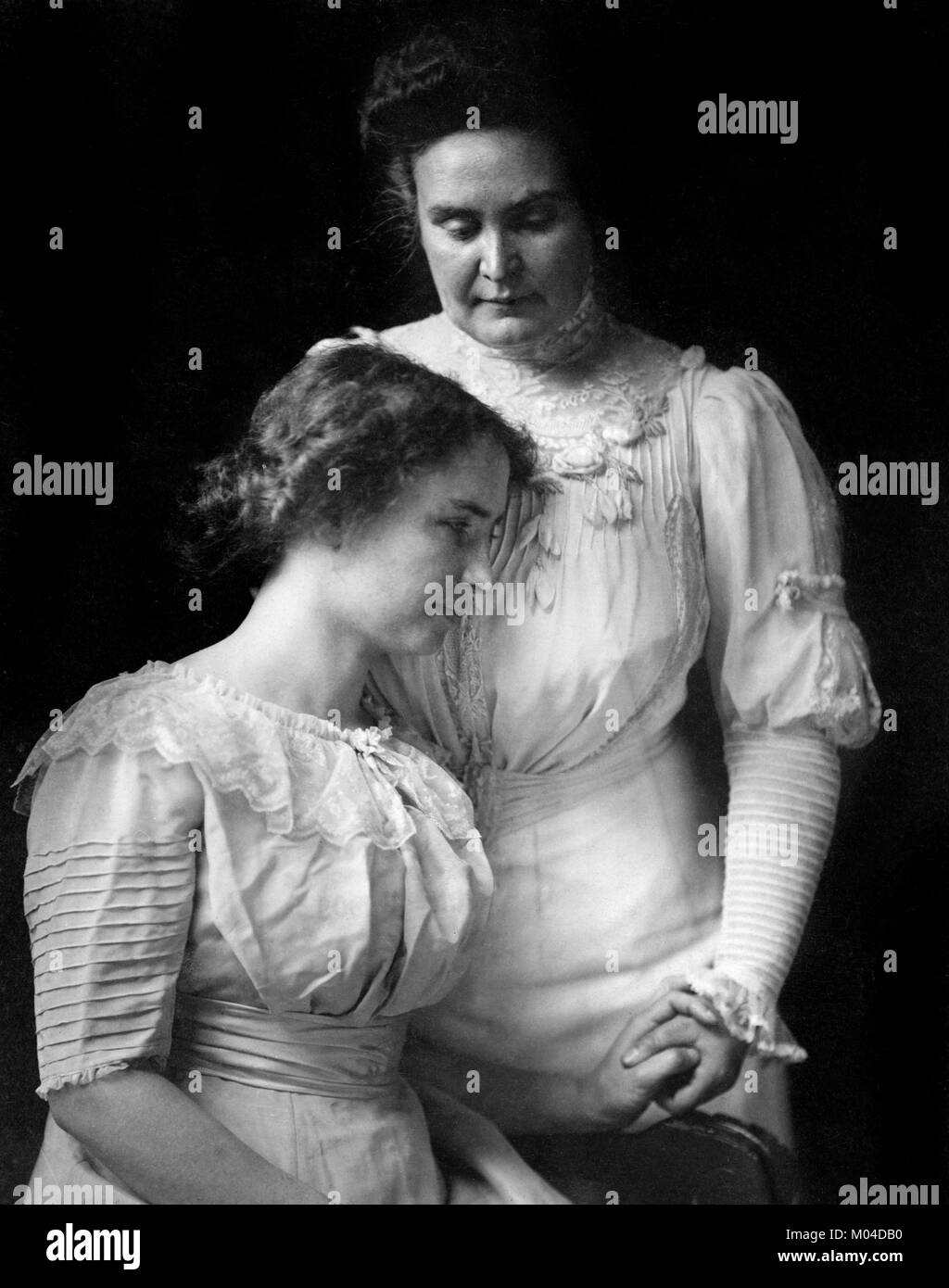 Helen Keller (1880-1968) and Anne Sullivan. Phototgraph of the deaf-blind author and political activist with her teacher and companion, c.1909 Stock Photo