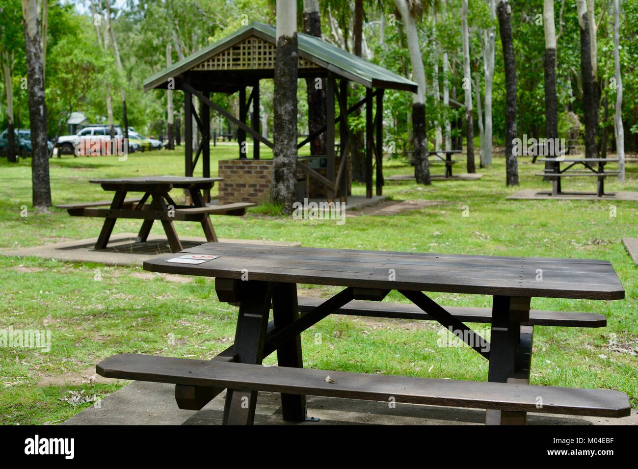 Brown wood public picnic table and chairs, alternatively benches at ...