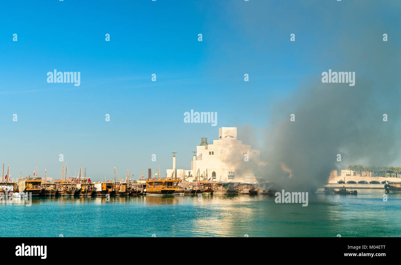 Traditional arabic dhow on fire in Doha, Qatar Stock Photo
