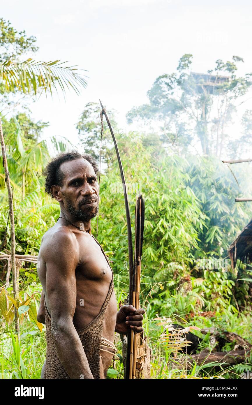 The Papuan from a Korowai tribe. Korowai kombai (Kolufo) with bow and