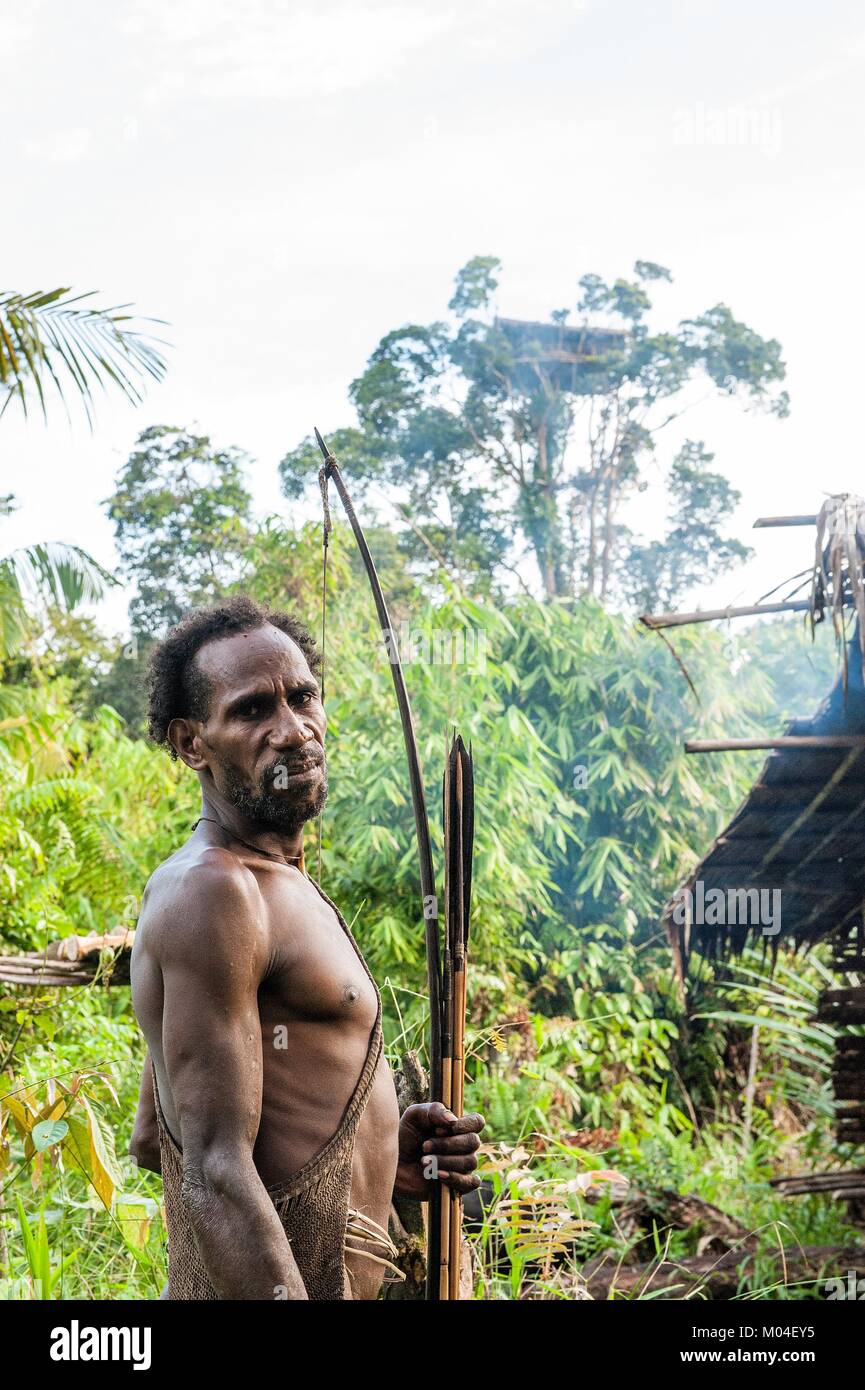 The Papuan from a Korowai tribe. Korowai kombai (Kolufo) with bow and