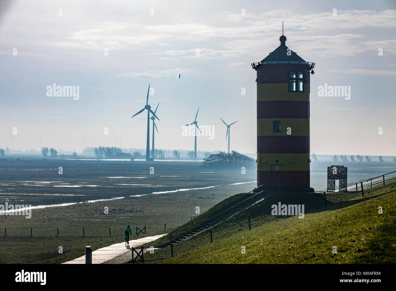 The Pilsum lighthouse on the North Sea dyke near Greetsiel, East Frisia, Lower Saxony, Germany, Stock Photo