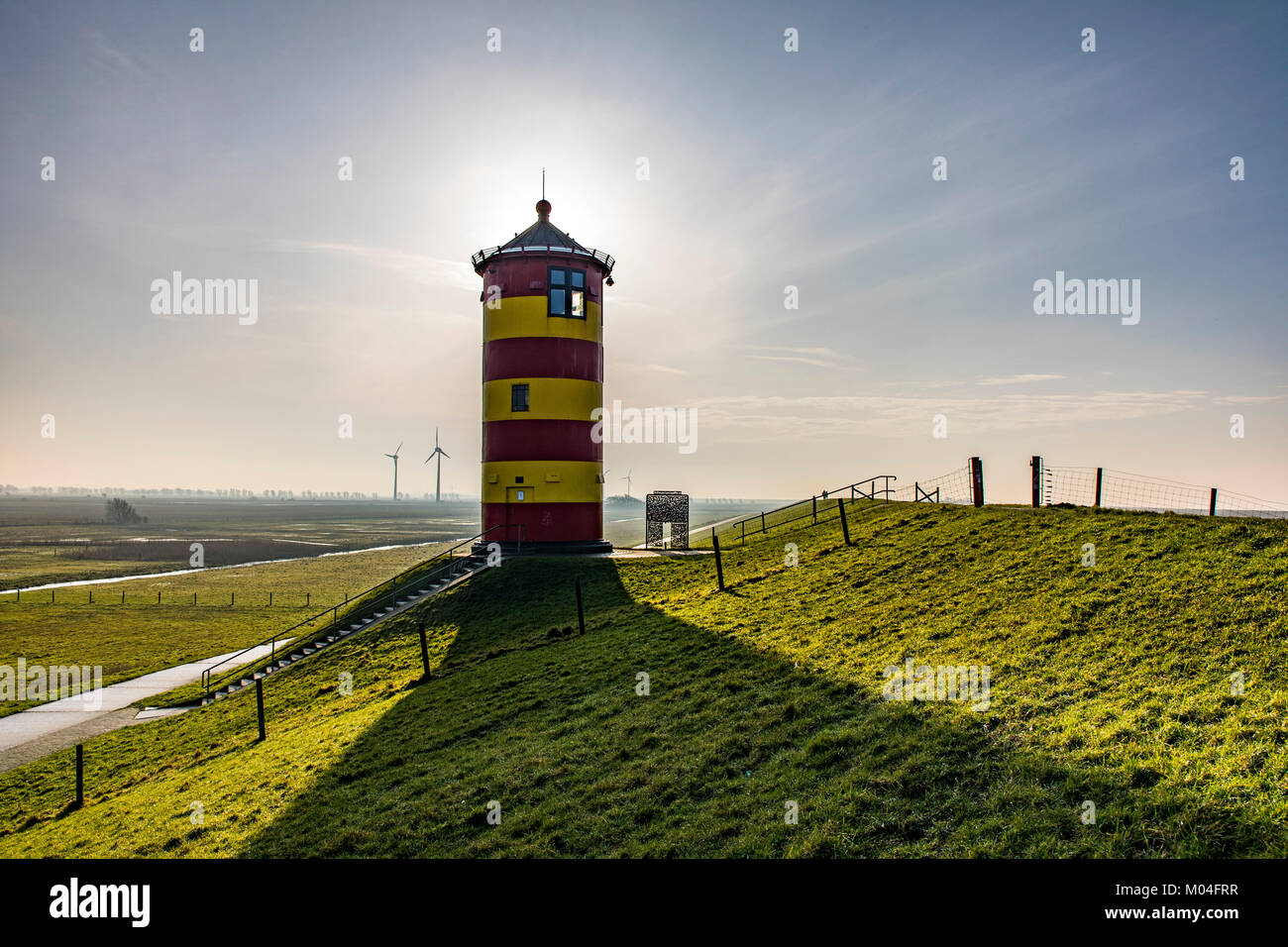 The Pilsum lighthouse on the North Sea dyke near Greetsiel, East Frisia, Lower Saxony, Germany, Stock Photo