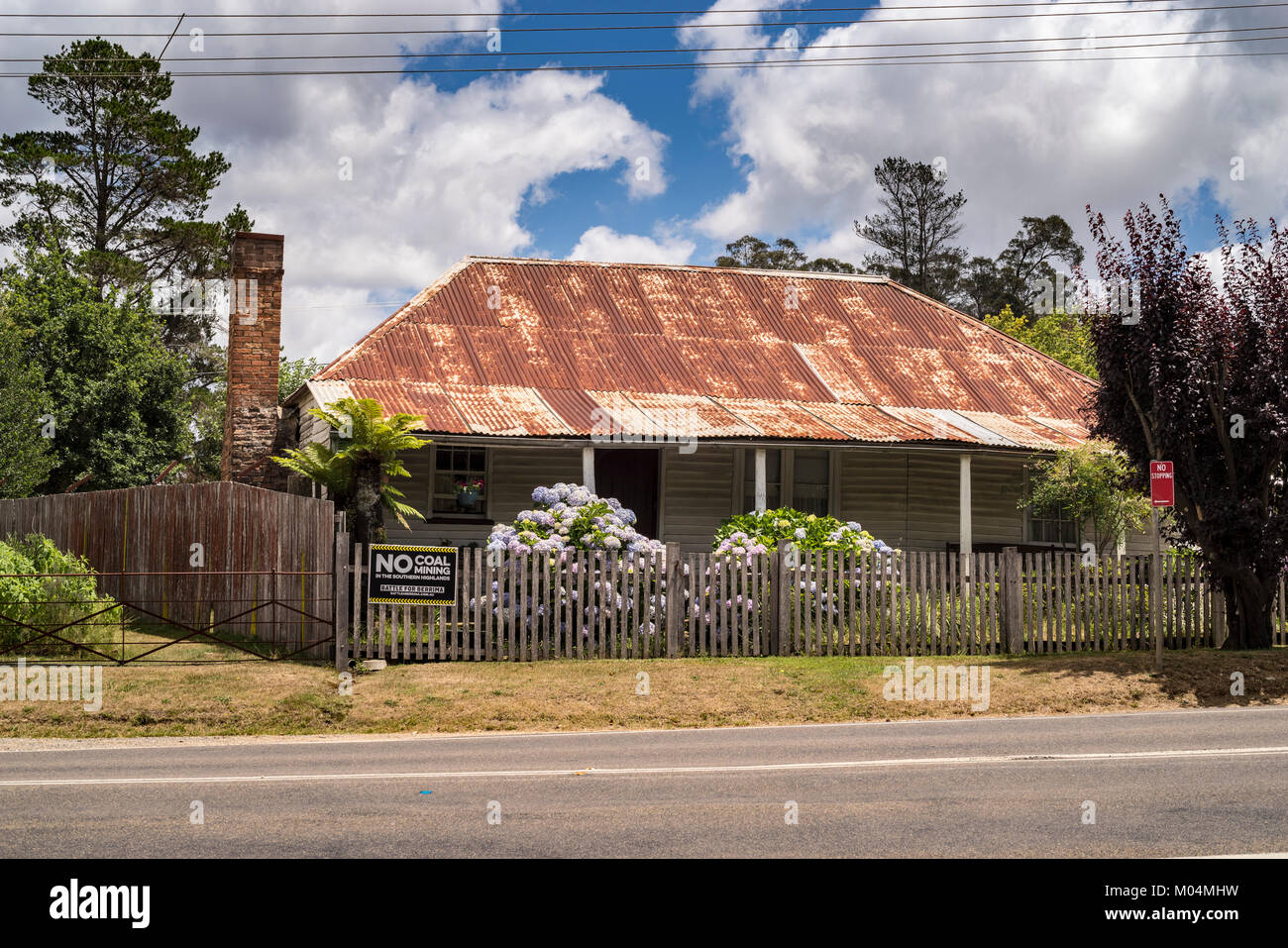Old Cottage with rusty corrugated iron roof, Berrima, Southern Highlands, New South Wales, NSW, Australia Stock Photo