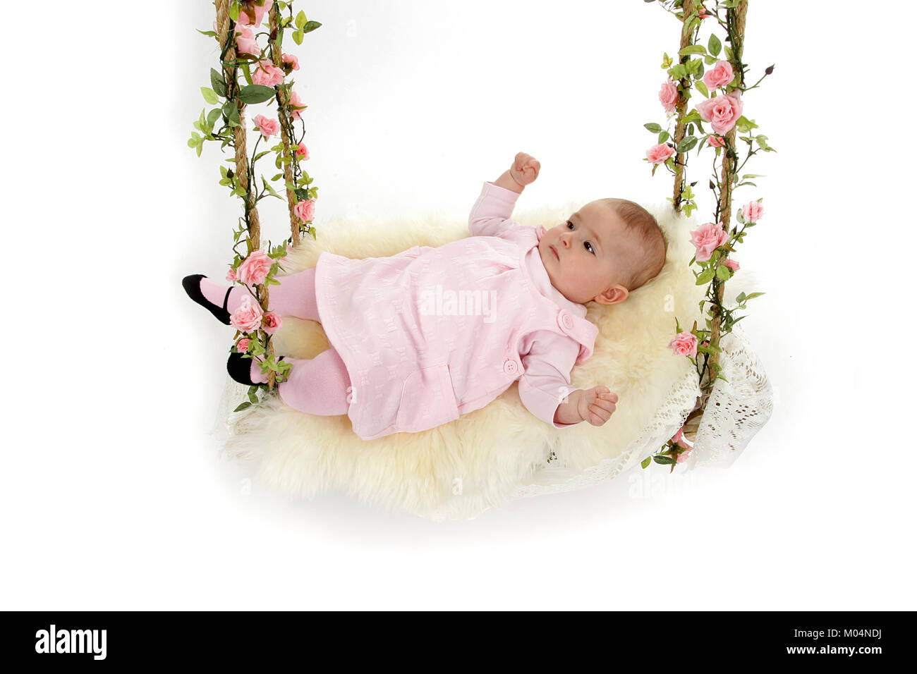 6 month old little girl in vintage swing Stock Photo