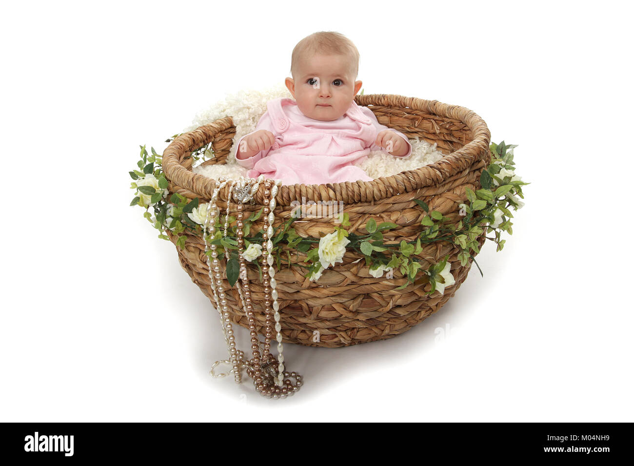 6 month old little girl in vintage wicker basket Stock Photo