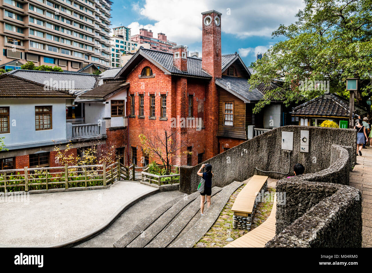 A tourist is taking a photo of the Beitou Hot Spring Museum in Taipei, Taiwan. Stock Photo