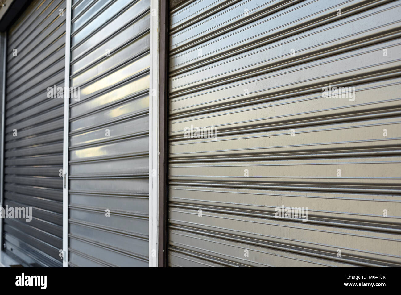 Metal gate protecting a store. Close shop Stock Photo Alamy