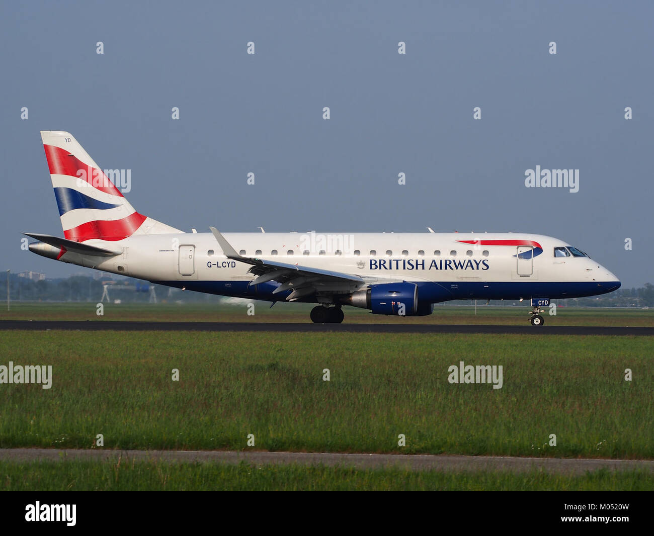 British Airways aircraft with registration G-LCYD photographed at Schiphol Airport, showcasing its livery and aircraft design. Stock Photo