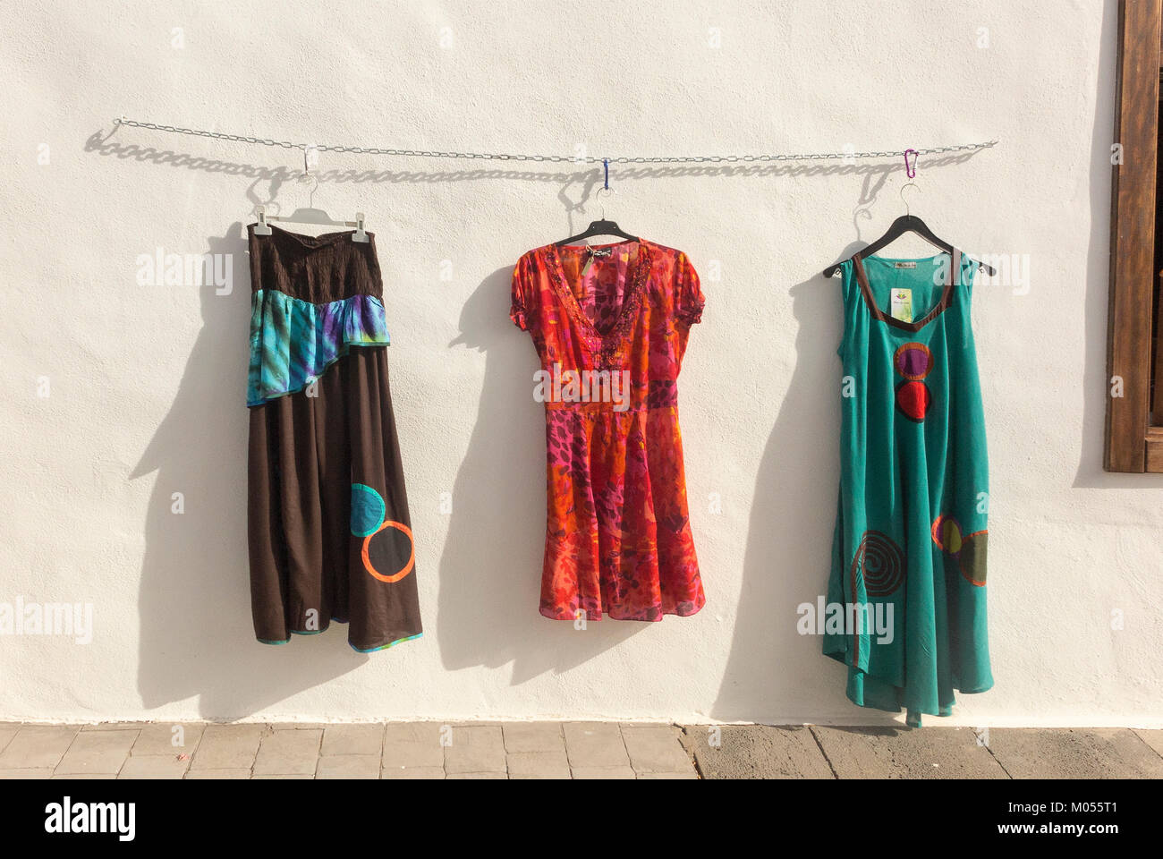 Clothing for sale displayed outside shop at weekly Teguise Market Lanzarote, Canary Islands. Stock Photo