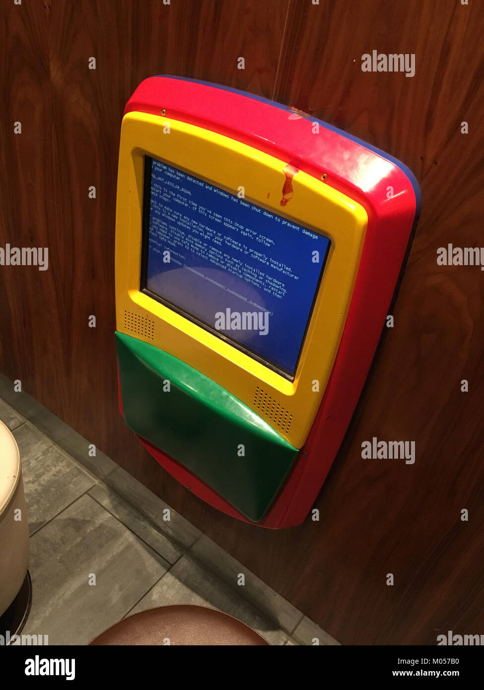 The 'Blue Screen of Death' (BSoD) at McDonald's refers to an error event, possibly related to an incident involving technology at a McDonald's location in 1901, likely referencing a technological mishap. Stock Photo