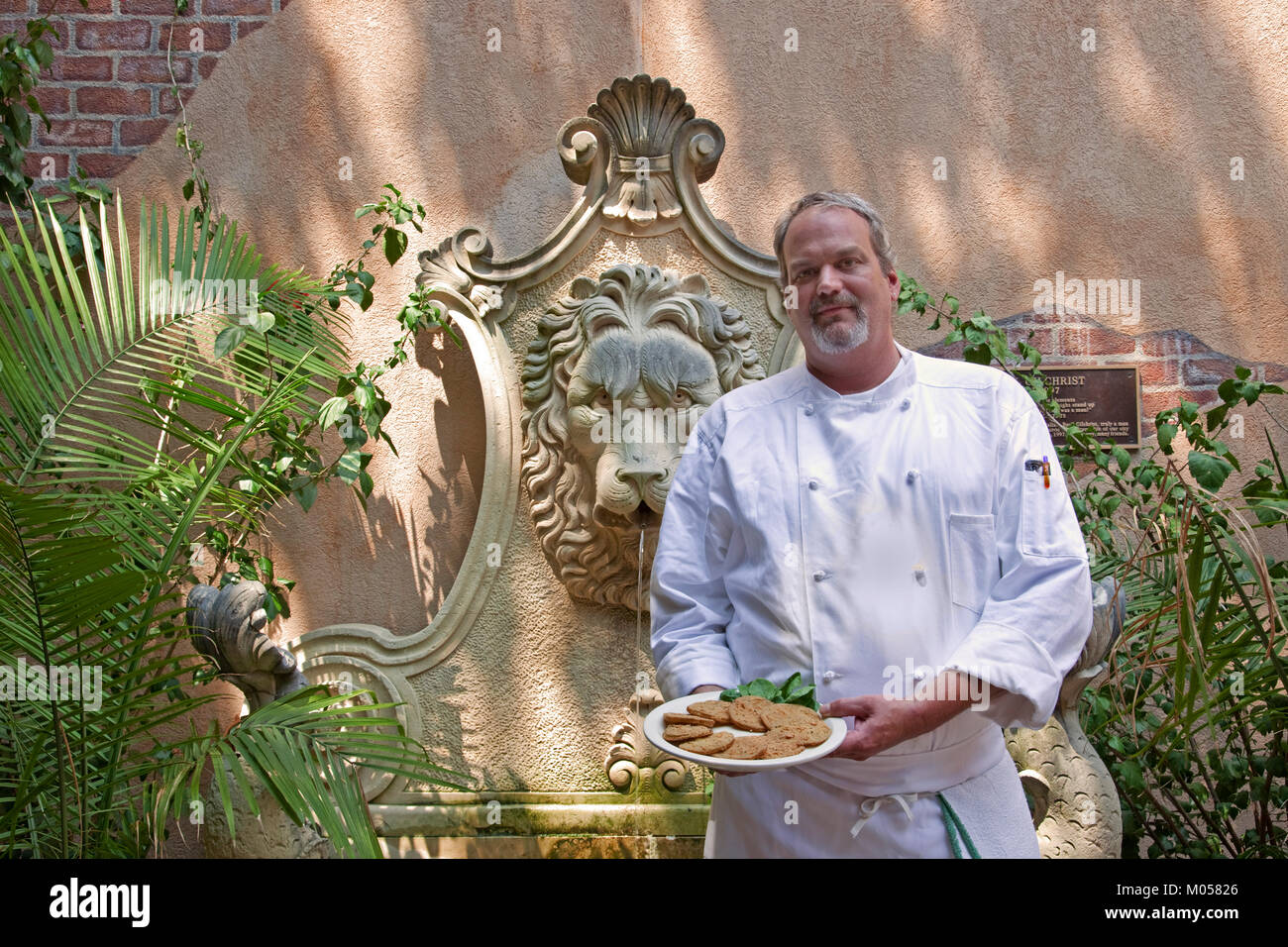 Chef  holds a plate of Fried Green Tomatoes Stock Photo