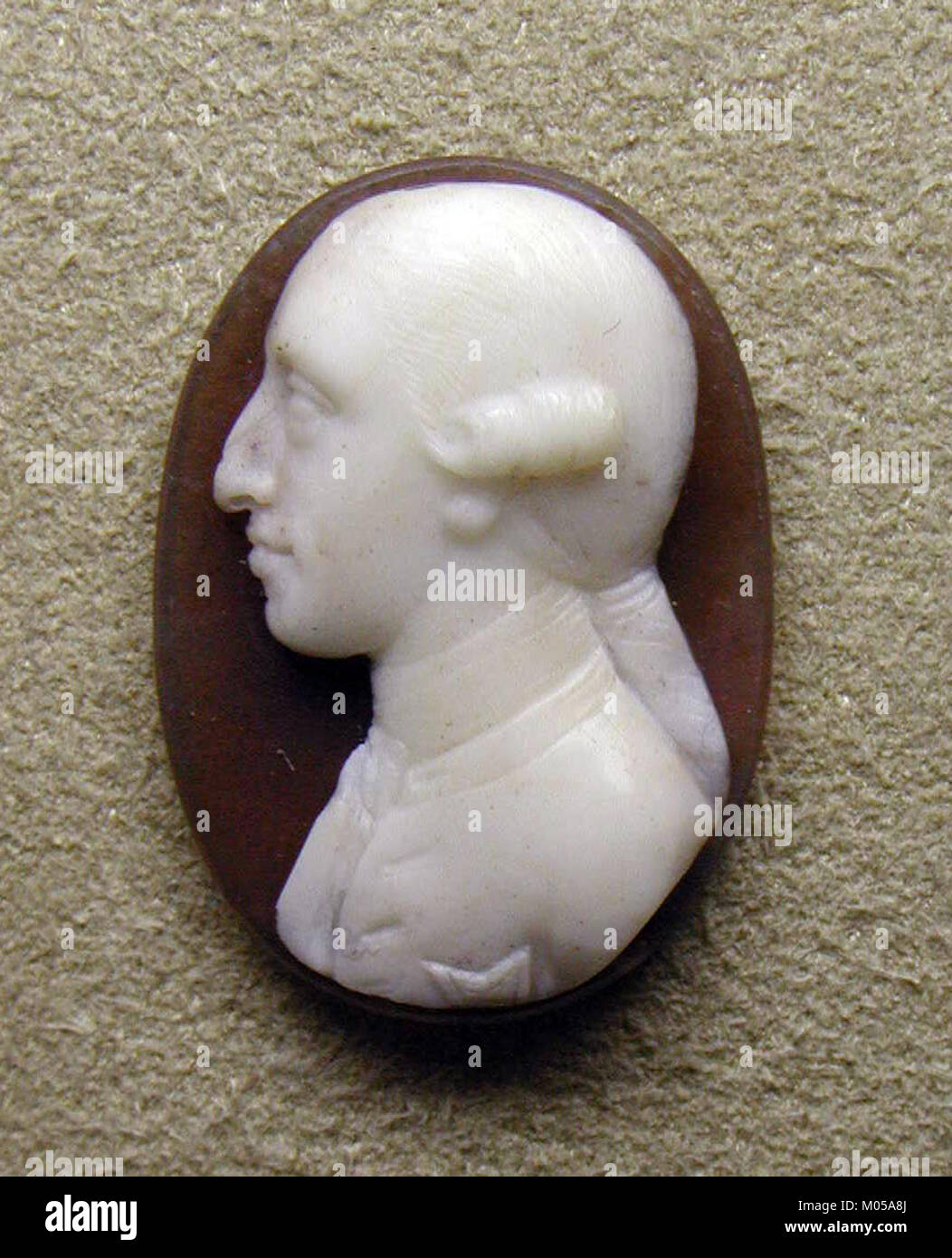 The bust of a young man, possibly a Hapsburg Prince, is a sculptural work from the Metropolitan Museum of Art. It represents the Hapsburg dynasty's influence in European history and its prominence in royal art and portraiture. Stock Photo