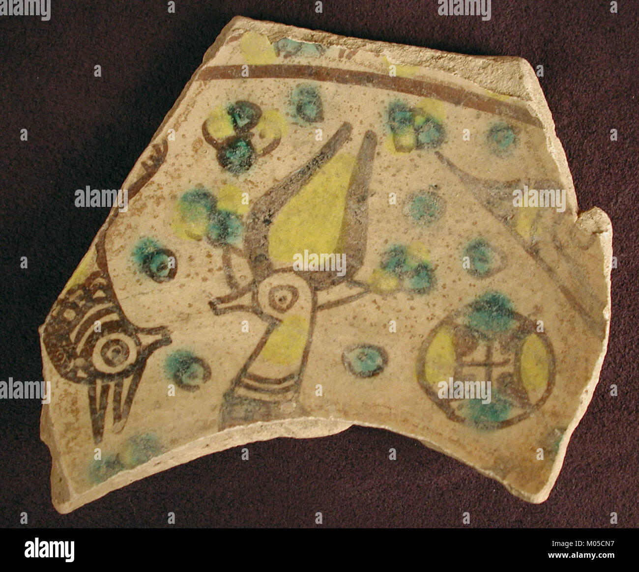 This fragment of Buff Ware features an intricate design with horned ...