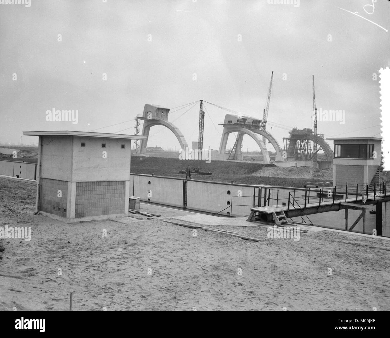 This title refers to the construction of the Lek-Hagestein dam complex in the Netherlands, a key infrastructure project aimed at flood control and water management in the region. The project plays a crucial role in the country's extensive network of water management systems. Stock Photo