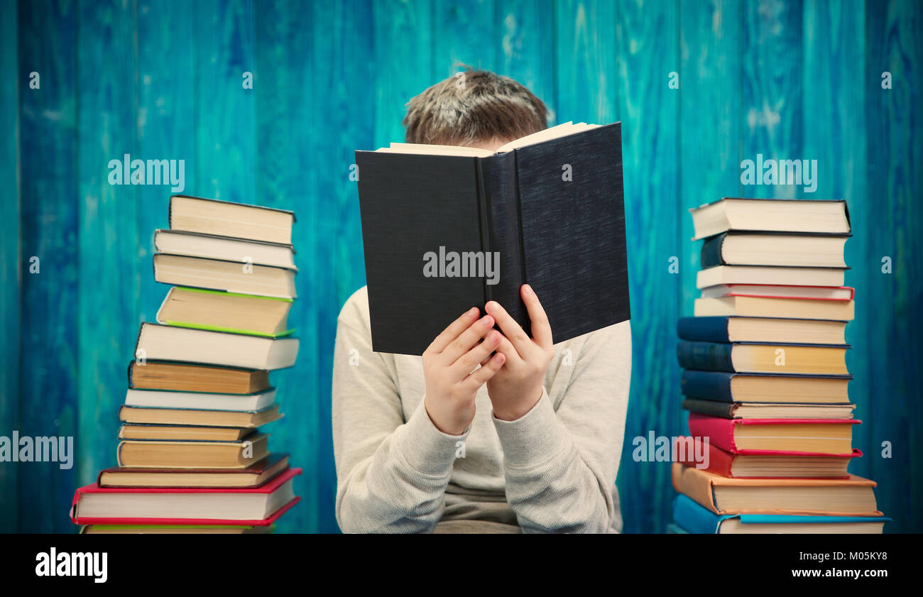 eight years old child reading a book Stock Photo Alamy