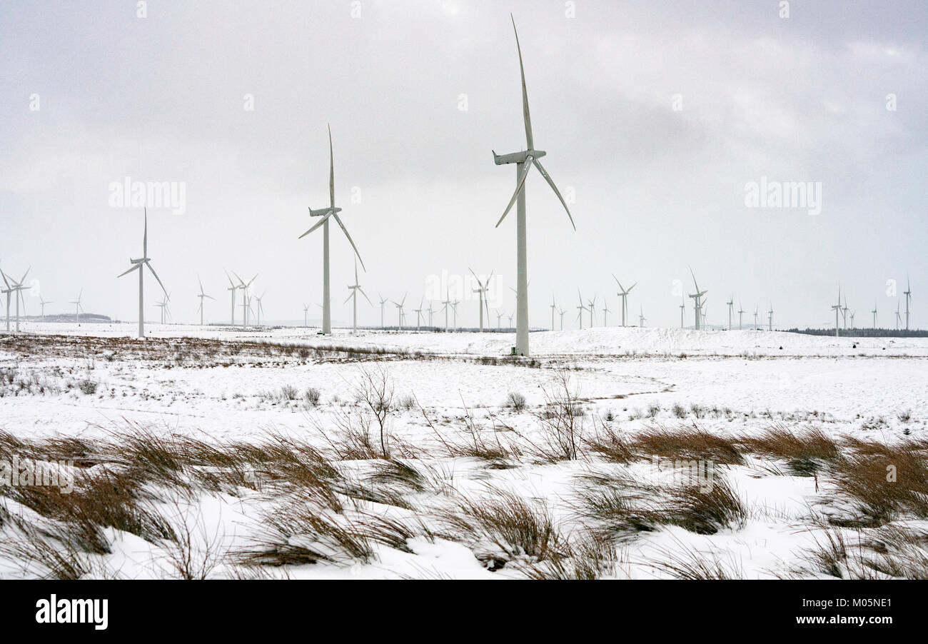 View of wind turbines at Whitelee Windfarm after snow fall in winter  operated by Scottish power, Scotland, United Kingdom Stock Photo