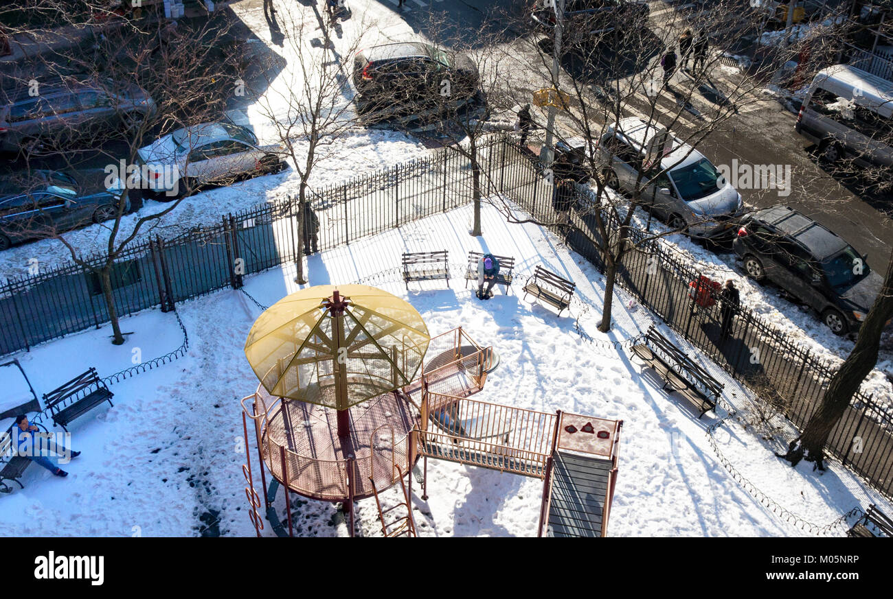 Overview of a small park in NYC in Winter with snow on the ground Stock