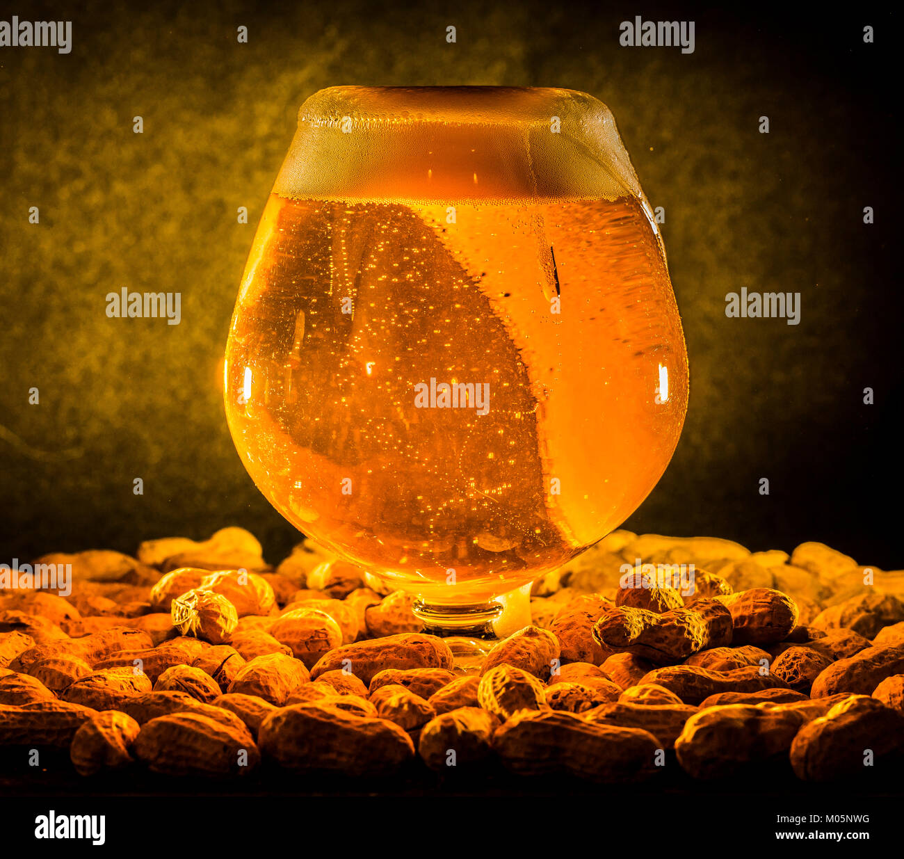 goblet of draft draught beer surrounded by nuts Stock Photo - Alamy