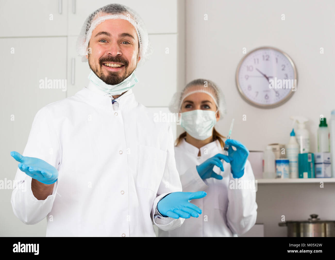 Smiling woman nurse and man doctor ready to work in office Stock Photo