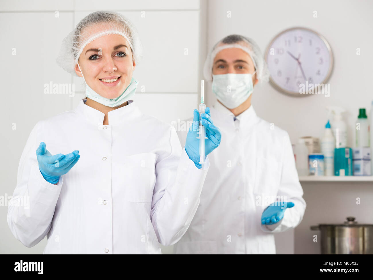 Smiling woman nurse and man doctor ready to work in office Stock Photo