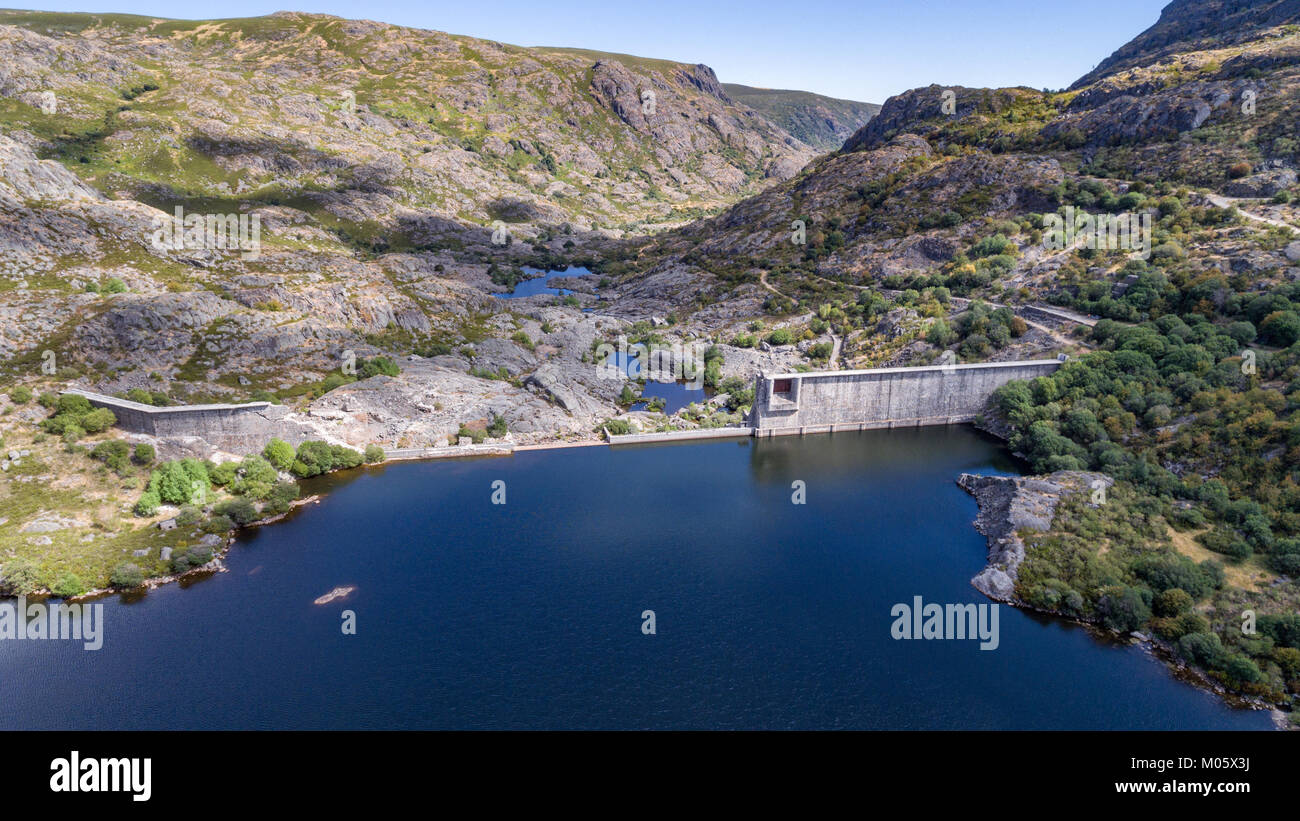 Aerial view of ruined dam on top of mountain Stock Photo