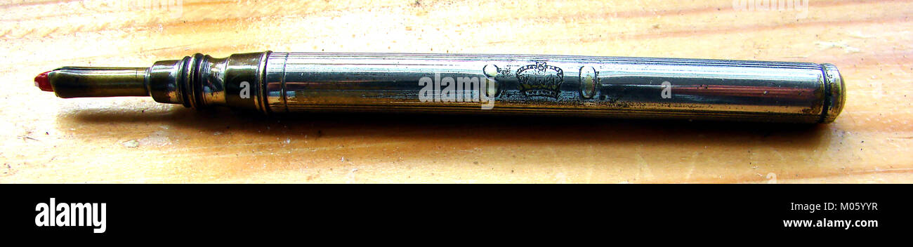 A silver marker pen used by  the British queensHMSO (Her Majesty's Stationery Office), England  with official government stamp Stock Photo