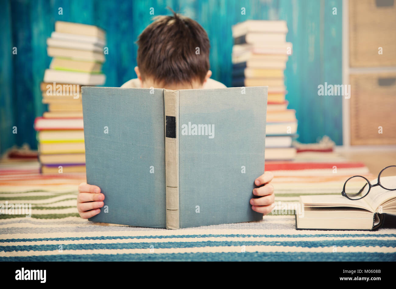 eight years old child reading a book Stock Photo Alamy