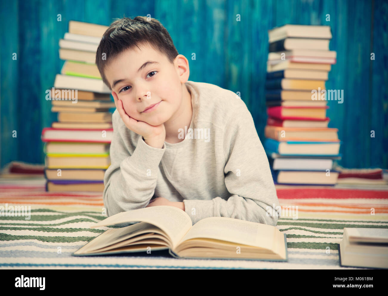 eight years old child reading a book Stock Photo Alamy