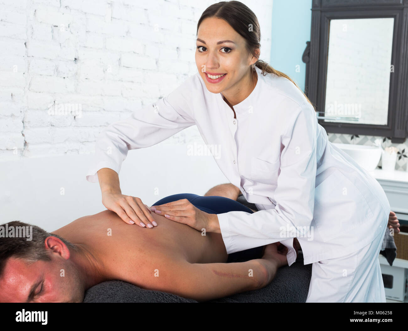 George does a professional massage to a sexy brunette
